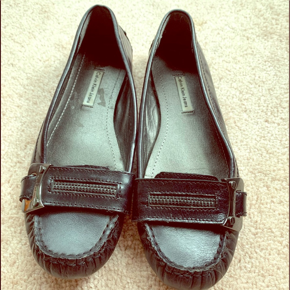 Calvin Klein Jeans black leather loafers.